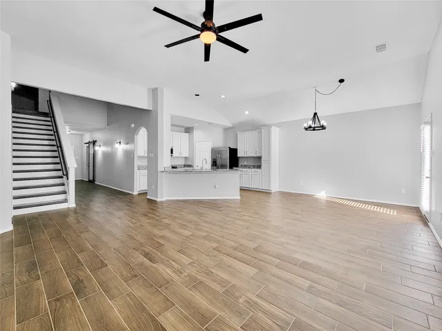 a view of a kitchen with a sink and a stove top oven