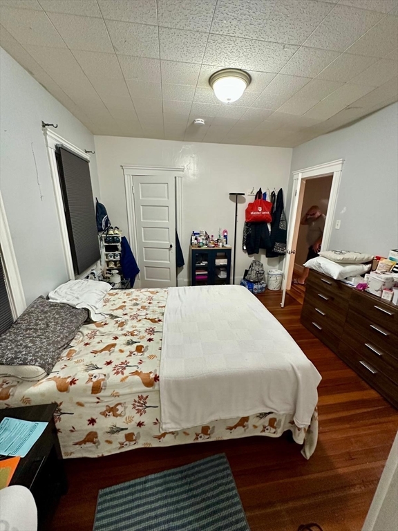 25 Seafoam Avenue, Unit 1 Winthrop, MA 02152 - Photo 9 of 17 a bed room with a bed window and a television