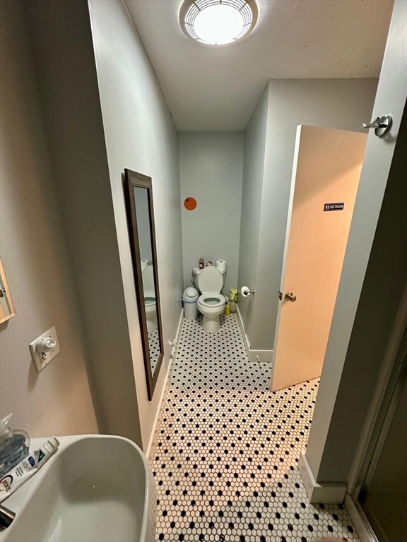 25 Seafoam Avenue, Unit 1 Winthrop, MA 02152 - Photo 10 of 17 a bathroom with a sink and a mirror