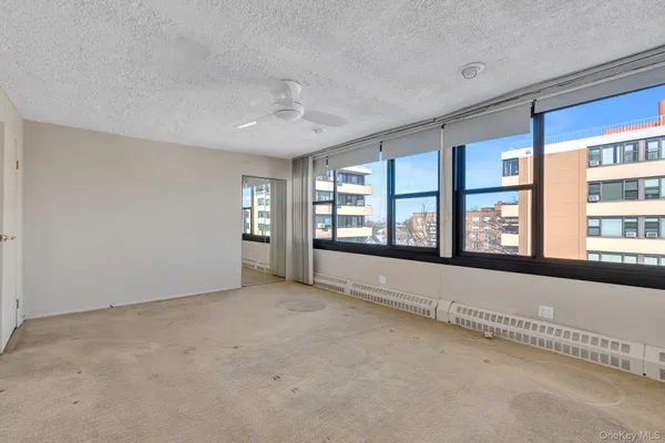 a view of an empty room with a window