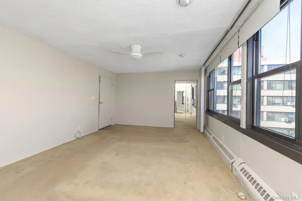 a view of an empty room with a window