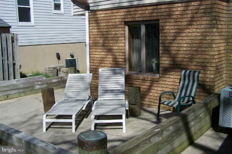 2005 Shore Drive Edgewater, MD 21037 - Photo 18 of 29 a front view of a house with stairs and wooden floor