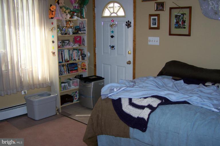 2005 Shore Drive Edgewater, MD 21037 - Photo 3 of 29 a bedroom with a bed dresser and a window