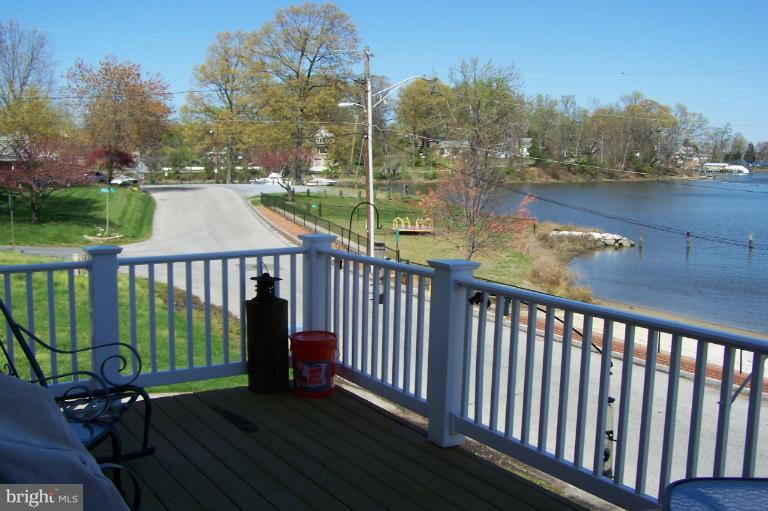 2005 Shore Drive Edgewater, MD 21037 - Photo 21 of 29 a balcony with wooden floor table and chairs