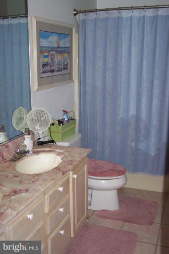 2005 Shore Drive Edgewater, MD 21037 - Photo 23 of 29 a bathroom with a granite countertop sink and a mirror