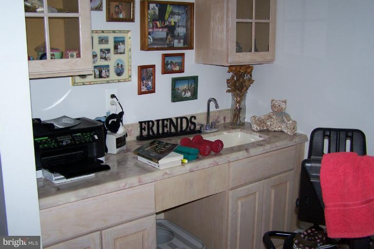2005 Shore Drive Edgewater, MD 21037 - Photo 26 of 29 a kitchen with stainless steel appliances granite countertop a sink and cabinets