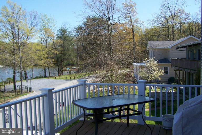 2005 Shore Drive Edgewater, MD 21037 - Photo 9 of 29 a view of a chairs and table in the deck