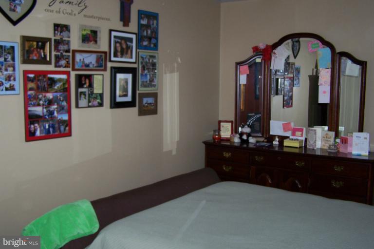 2005 Shore Drive Edgewater, MD 21037 - Photo 10 of 29 a bed room with a bed and a mirror