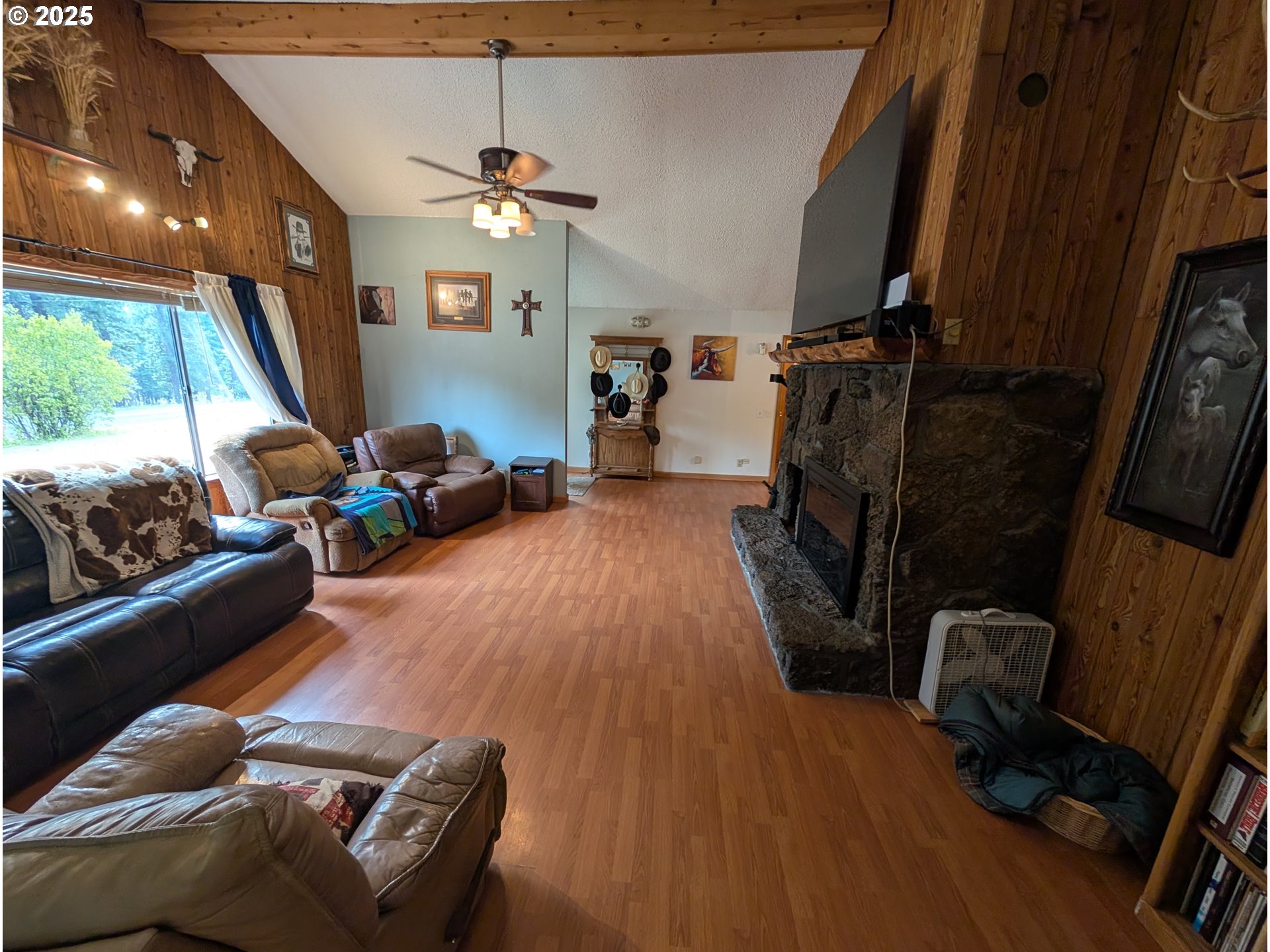 71168 Valley View Road Elgin, OR 97827 - Photo 3 of 32 a living room with furniture and a flat screen tv