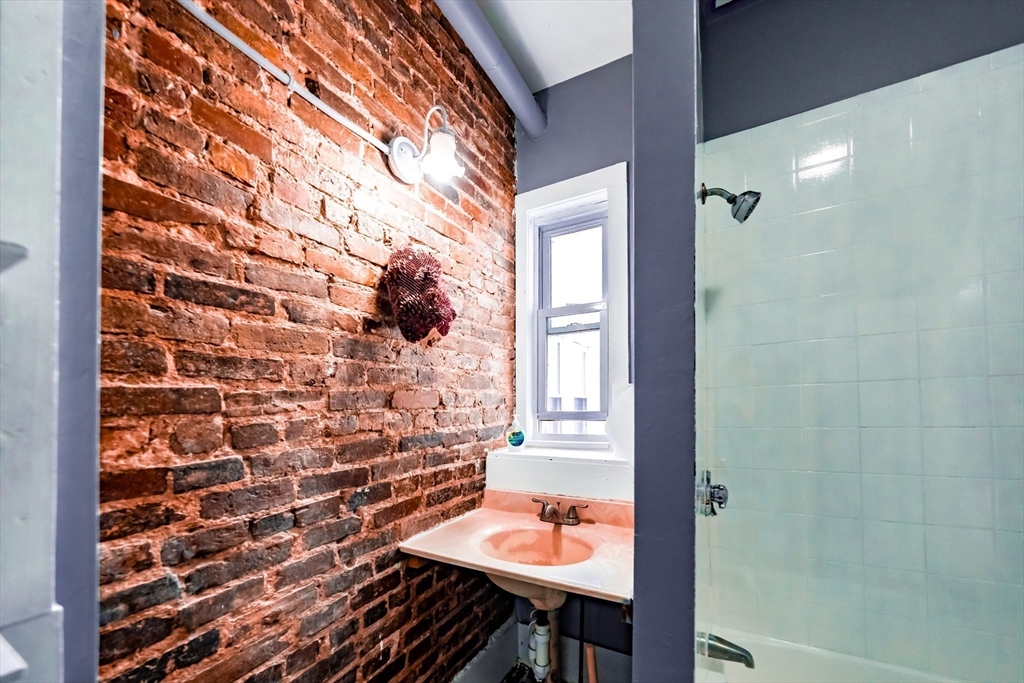 130 Shurtleff Street, Unit 3 Chelsea, MA 02150 - Photo 11 of 17 a bathroom with a sink and a mirror