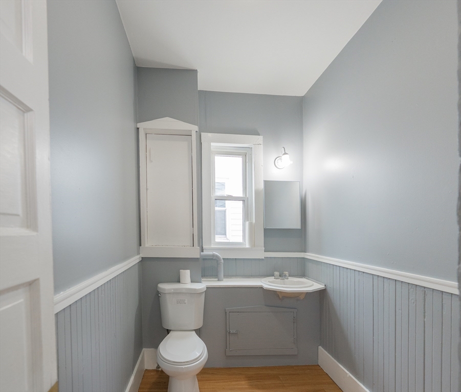 130 Shurtleff Street, Unit 3 Chelsea, MA 02150 - Photo 5 of 17 a bathroom with a sink a toilet and mirror