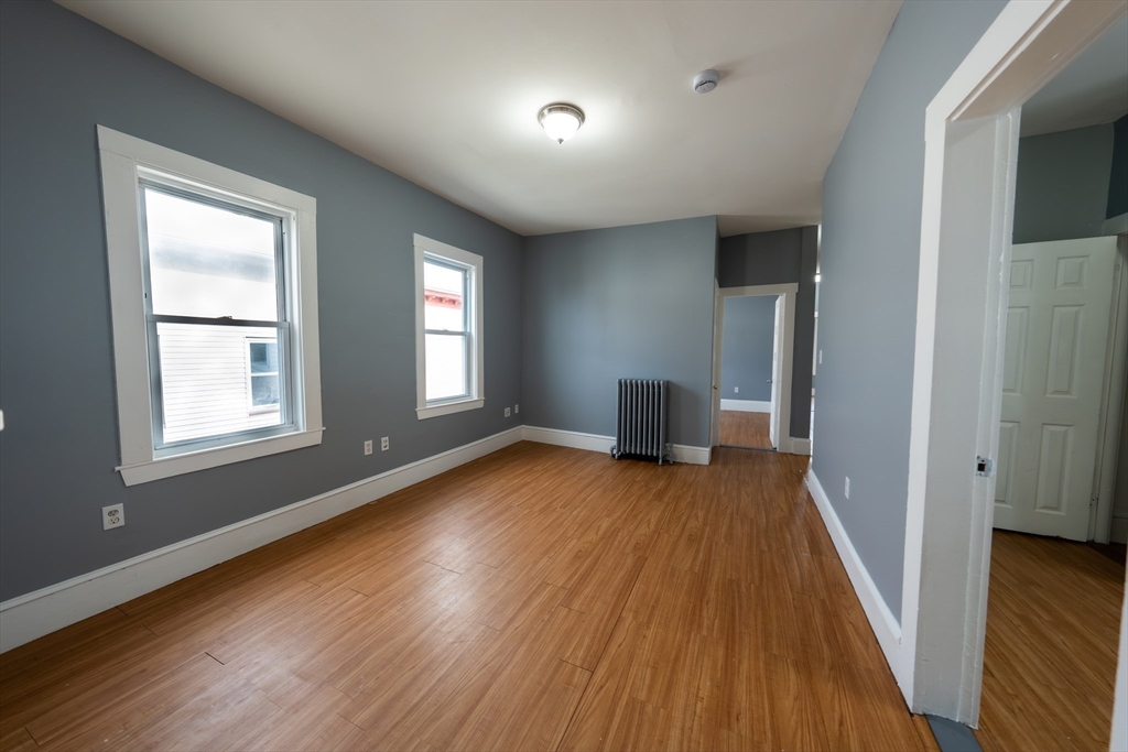 130 Shurtleff Street, Unit 3 Chelsea, MA 02150 - Photo 6 of 17 a view of empty room with wooden floor