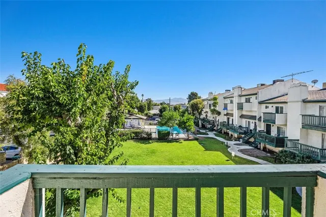a view of swimming pool from a balcony