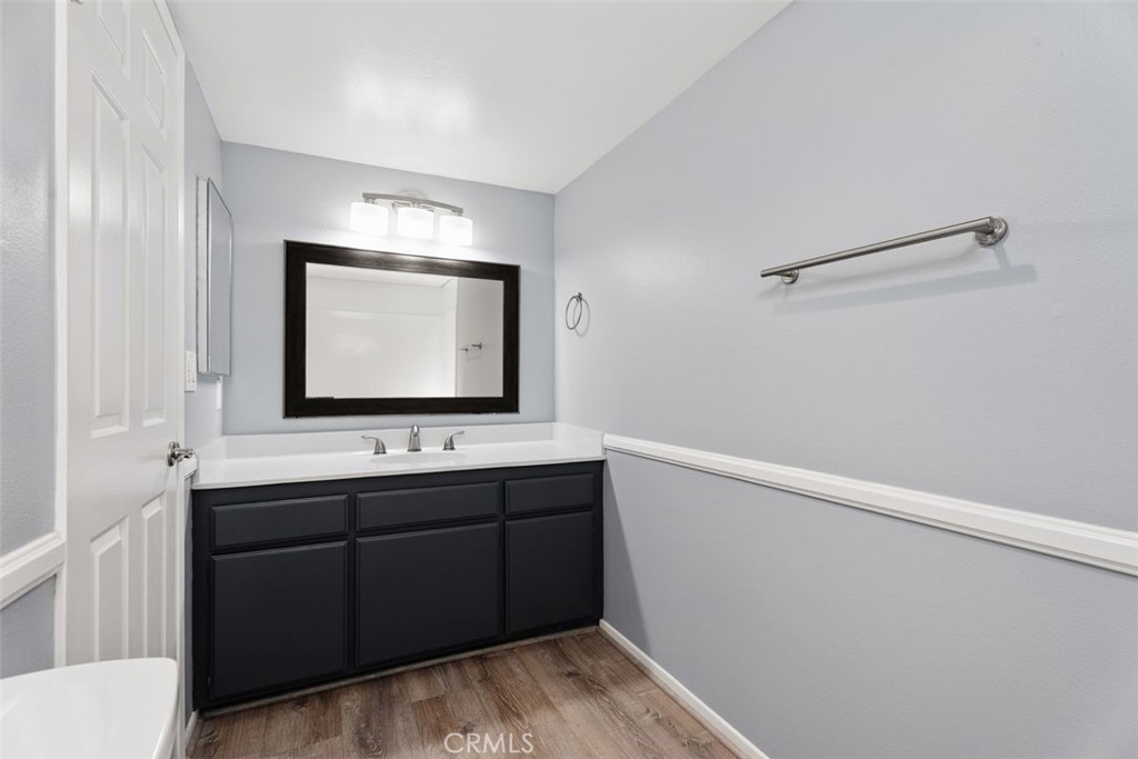 428 West First Street Tustin, CA 92780 - Photo 24 of 35 a bathroom with a sink and a mirror