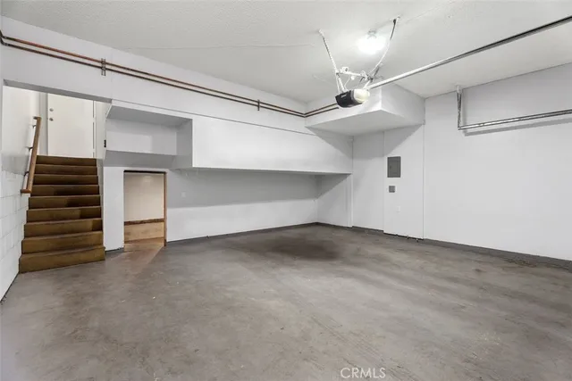 a view of an empty room with a ceiling fan