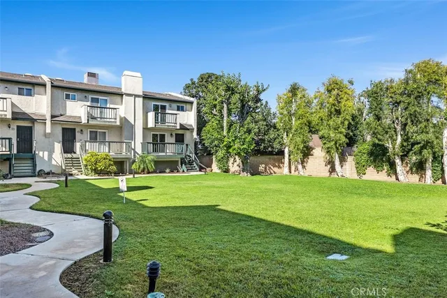 a garden with trees in front of it