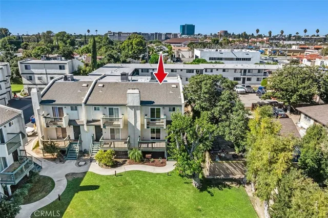 a view of a house with swimming pool and sitting area