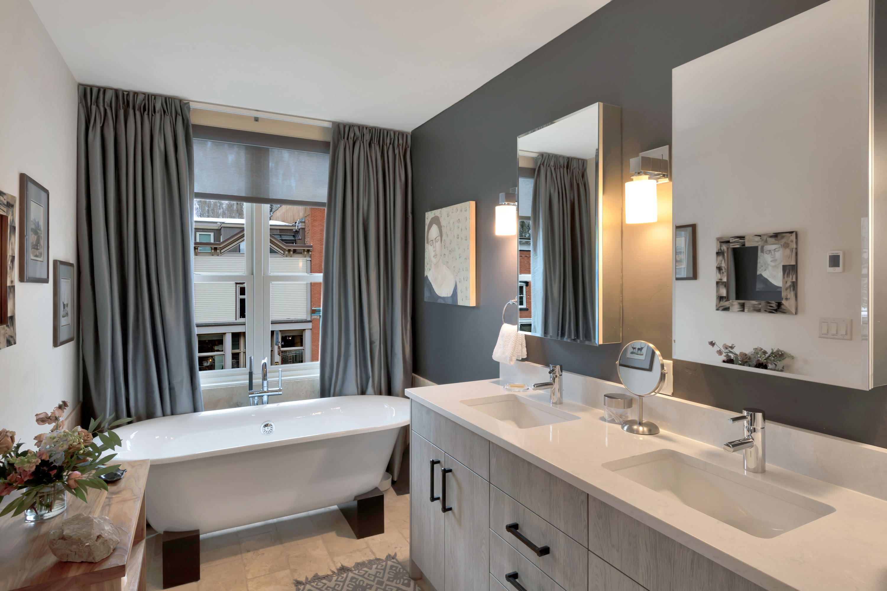 209 East Colorado Avenue, Unit R1 EH1 C1 C2 Telluride, CO 81435 - Photo 11 of 14 a bathroom with a tub sink and mirror