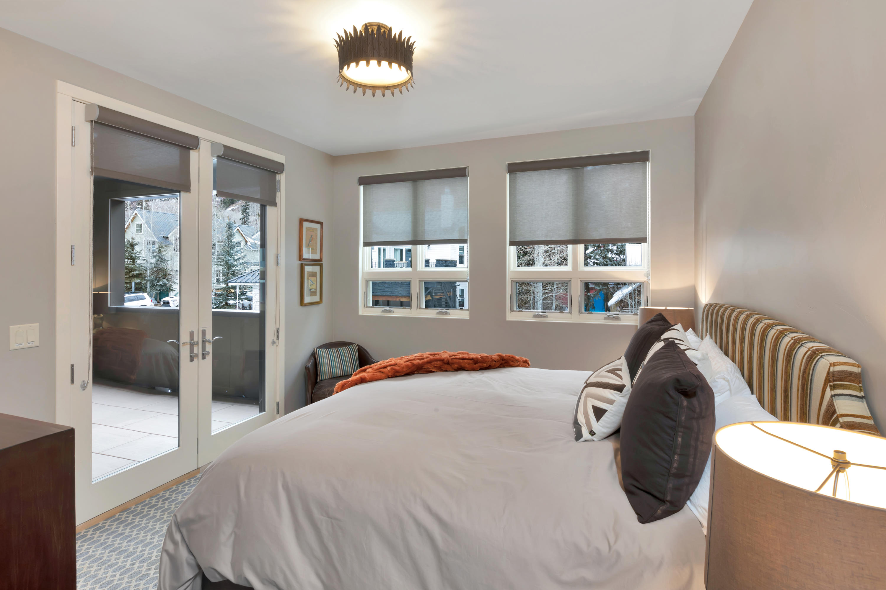 209 East Colorado Avenue, Unit R1 EH1 C1 C2 Telluride, CO 81435 - Photo 12 of 14 a bedroom with a bed and a large window