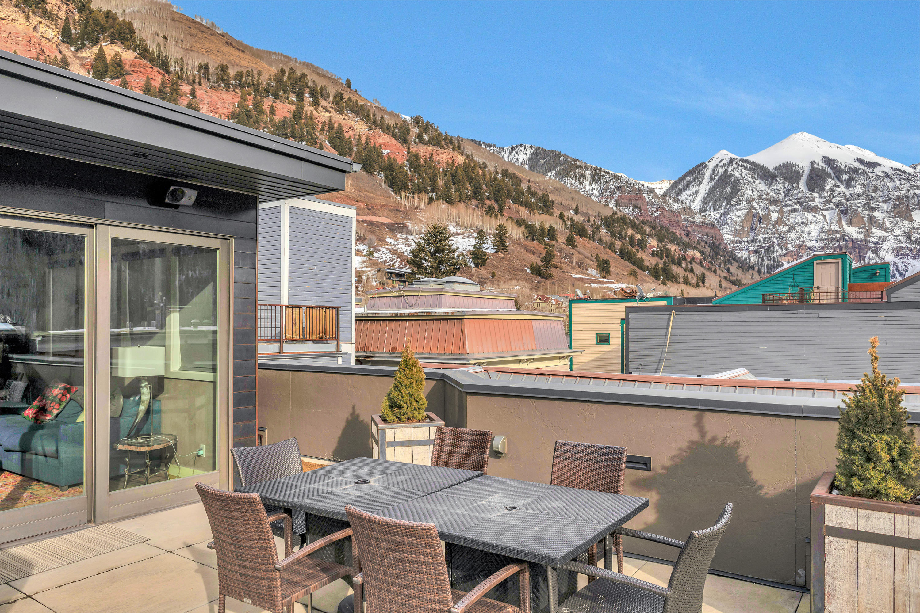 209 East Colorado Avenue, Unit R1 EH1 C1 C2 Telluride, CO 81435 - Photo 5 of 14 a view of a chairs and table in the balcony