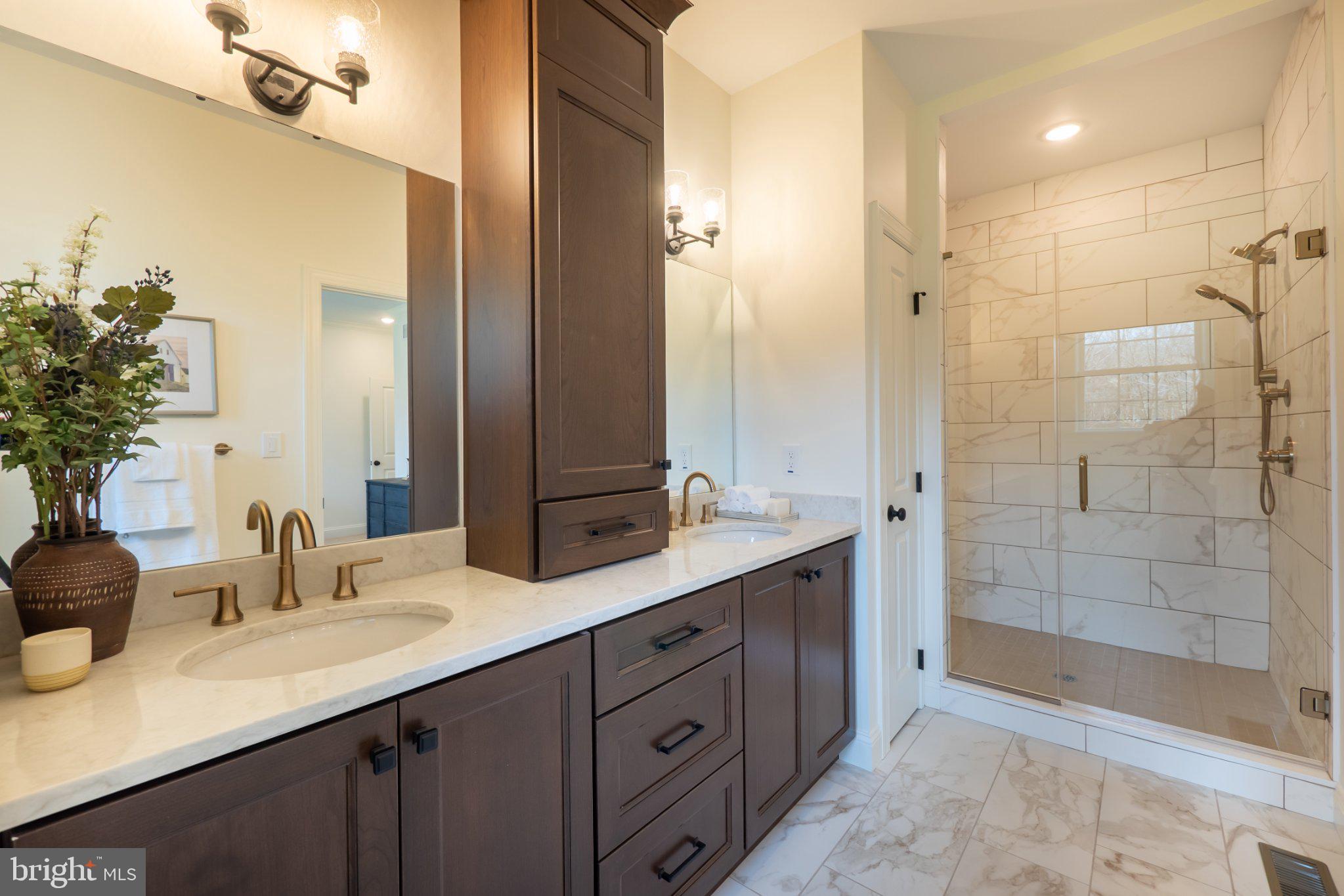 4630 Old Saucon Road Bethlehem, PA 18015 - Photo 23 of 33 a bathroom with a shower sink and mirror