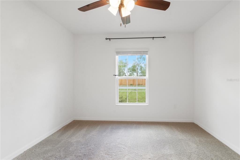 11380 Old Squaw Avenue Weeki Wachee, FL 34614 - Photo 16 of 23 an empty room with a window