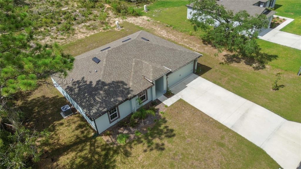 11380 Old Squaw Avenue Weeki Wachee, FL 34614 - Photo 18 of 23 a view of a house with a yard