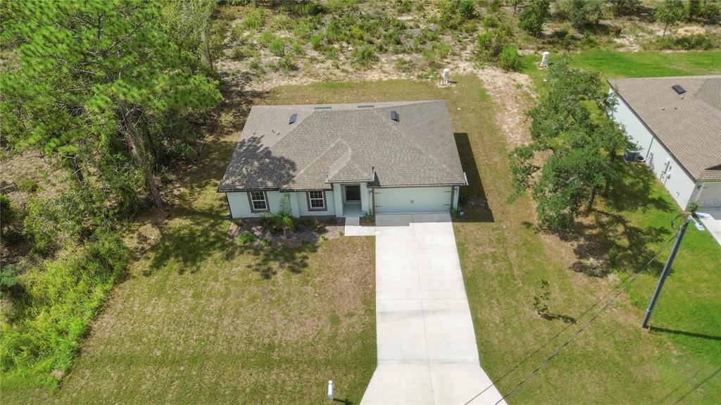 11380 Old Squaw Avenue Weeki Wachee, FL 34614 - Photo 19 of 23 aerial view of a house with a yard