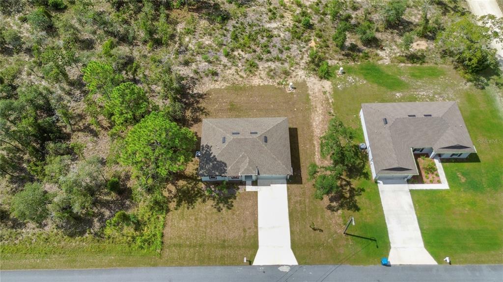 11380 Old Squaw Avenue Weeki Wachee, FL 34614 - Photo 23 of 23 an aerial view of residential houses with outdoor space