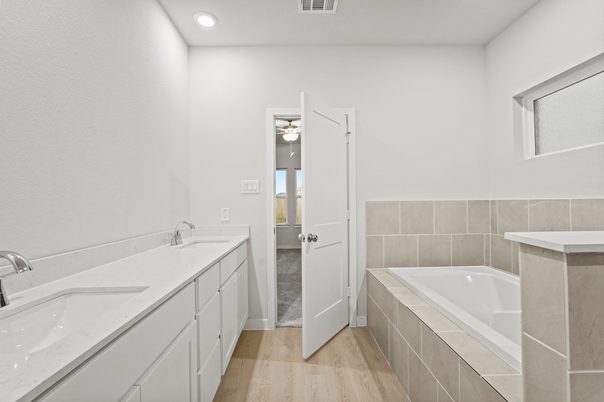141 Byu Bnd Boulevard Angleton, TX 77515 - Photo 11 of 26 a bathroom with a tub sink and mirror