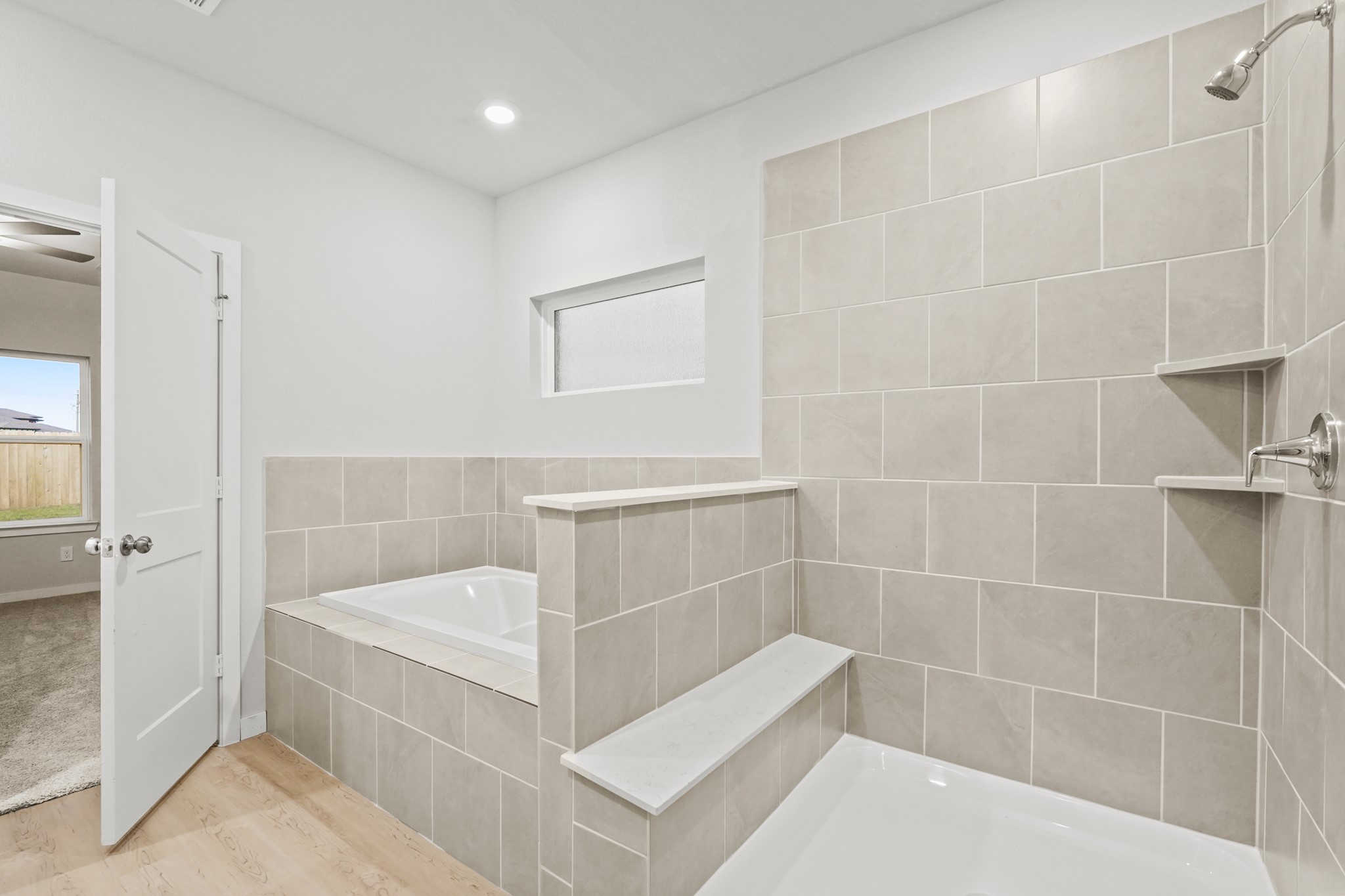 141 Byu Bnd Boulevard Angleton, TX 77515 - Photo 13 of 26 a bathroom with a bathtub and shower