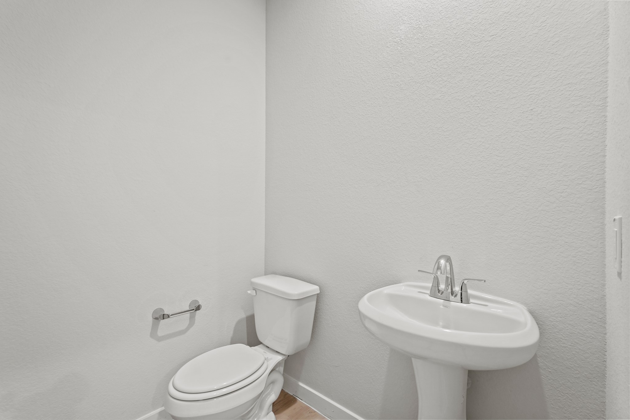 141 Byu Bnd Boulevard Angleton, TX 77515 - Photo 19 of 26 a bathroom with a sink a toilet and mirror