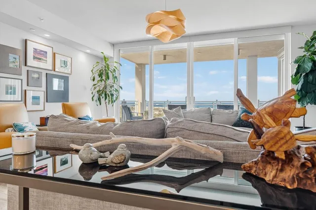 a bedroom with a large bed and a couch