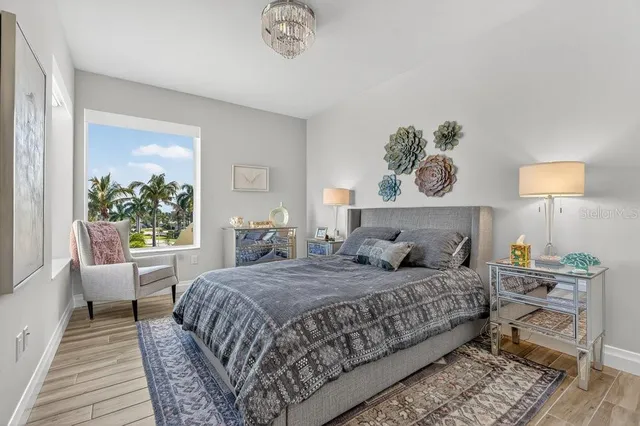 a bathroom with a bathtub shower sink mirror and toilet