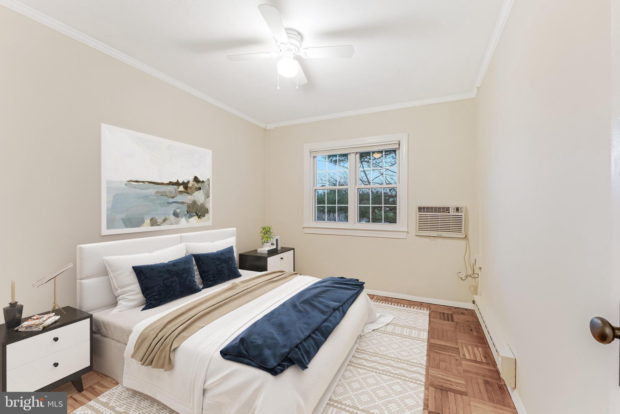 3228 Wellington Road Alexandria, VA 22302 - Photo 9 of 20 a bedroom with a large bed and a window