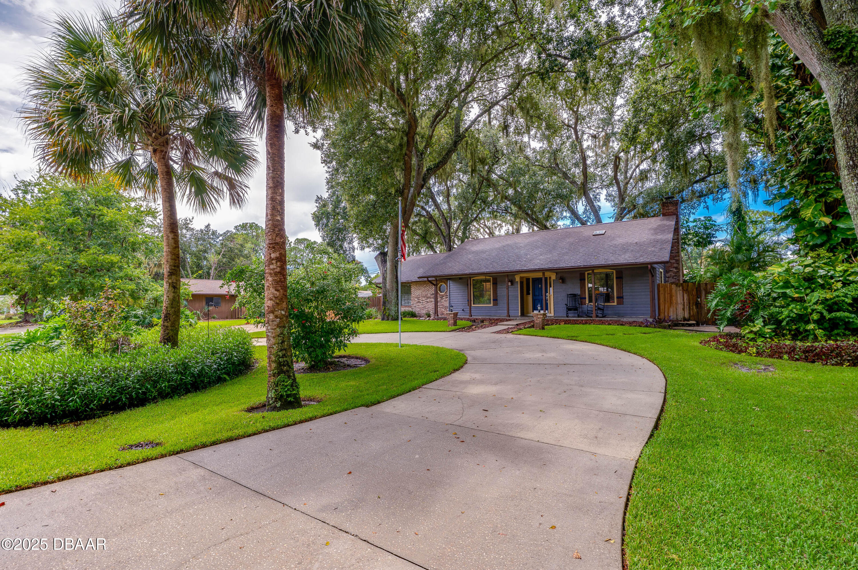 2824 Umbrella Tree Drive Edgewater, FL 32141 - Photo 1 of 36 front view of a house with a yard
