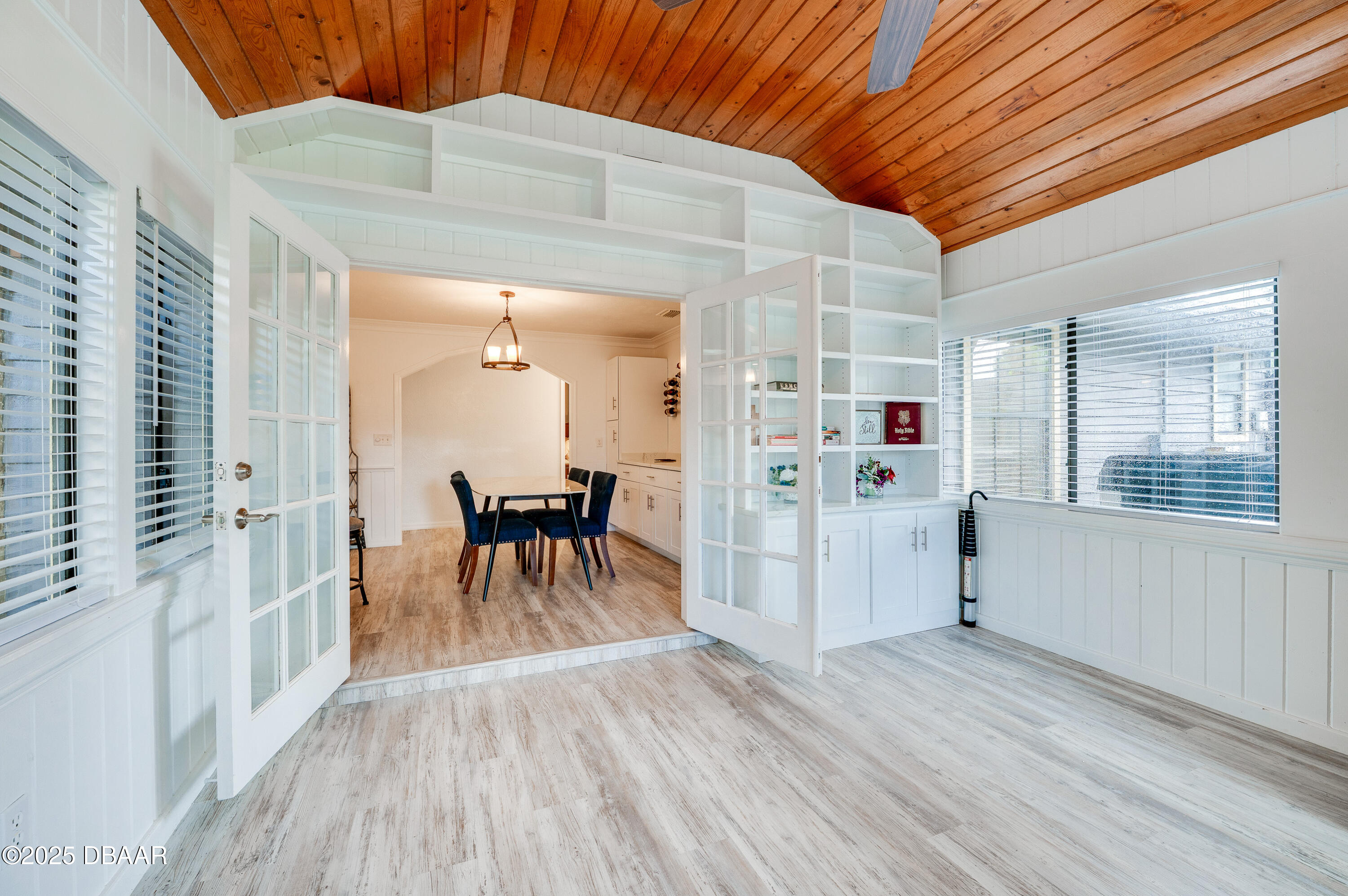 2824 Umbrella Tree Drive Edgewater, FL 32141 - Photo 26 of 36 a view of a dining room with furniture window and wooden floor