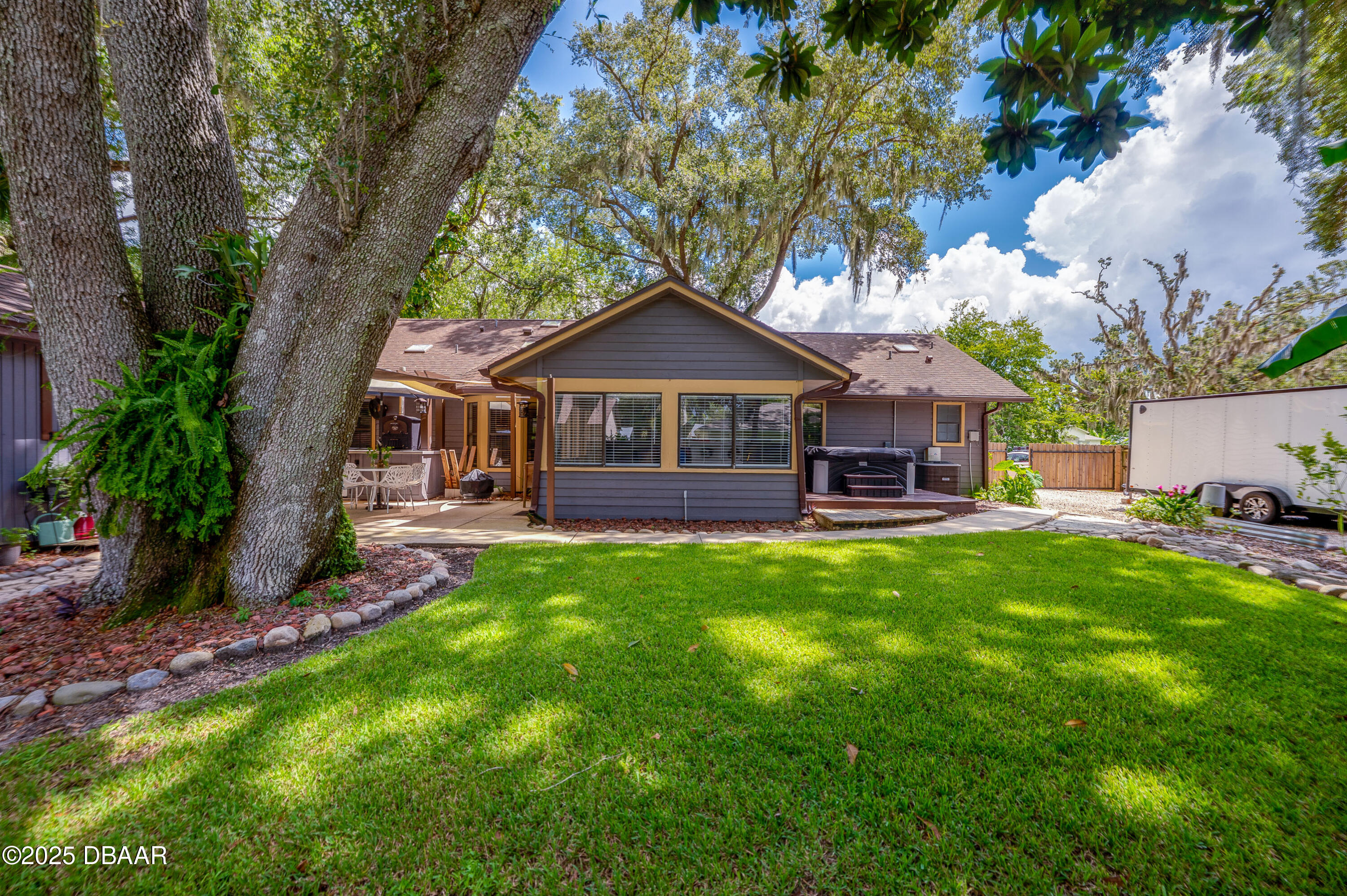 2824 Umbrella Tree Drive Edgewater, FL 32141 - Photo 32 of 36 a front view of a house with yard and green space
