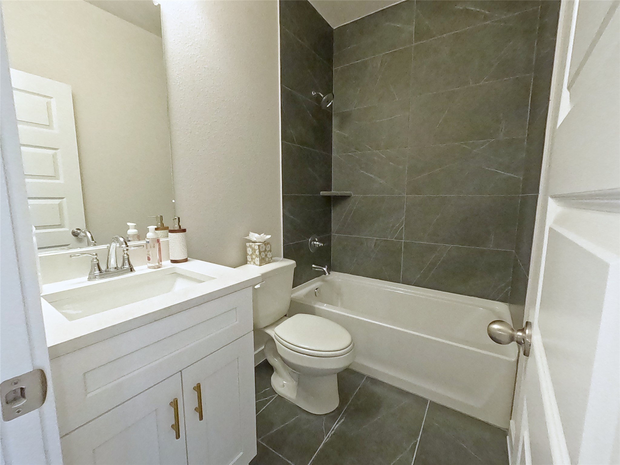 8323 Amber Summit Lane Angleton, TX 77515 - Photo 11 of 24 a bathroom with a sink a toilet and shower