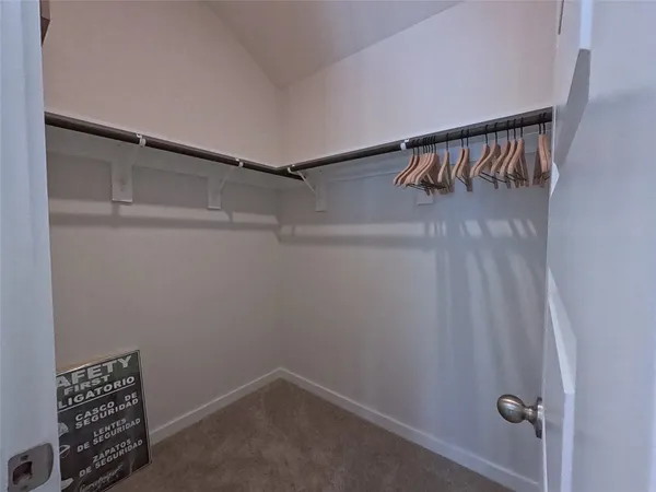 a view of a kitchen with kitchen island a counter top space a sink appliances and cabinets
