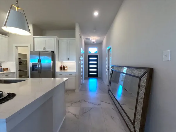 a view of kitchen with dining table and chairs