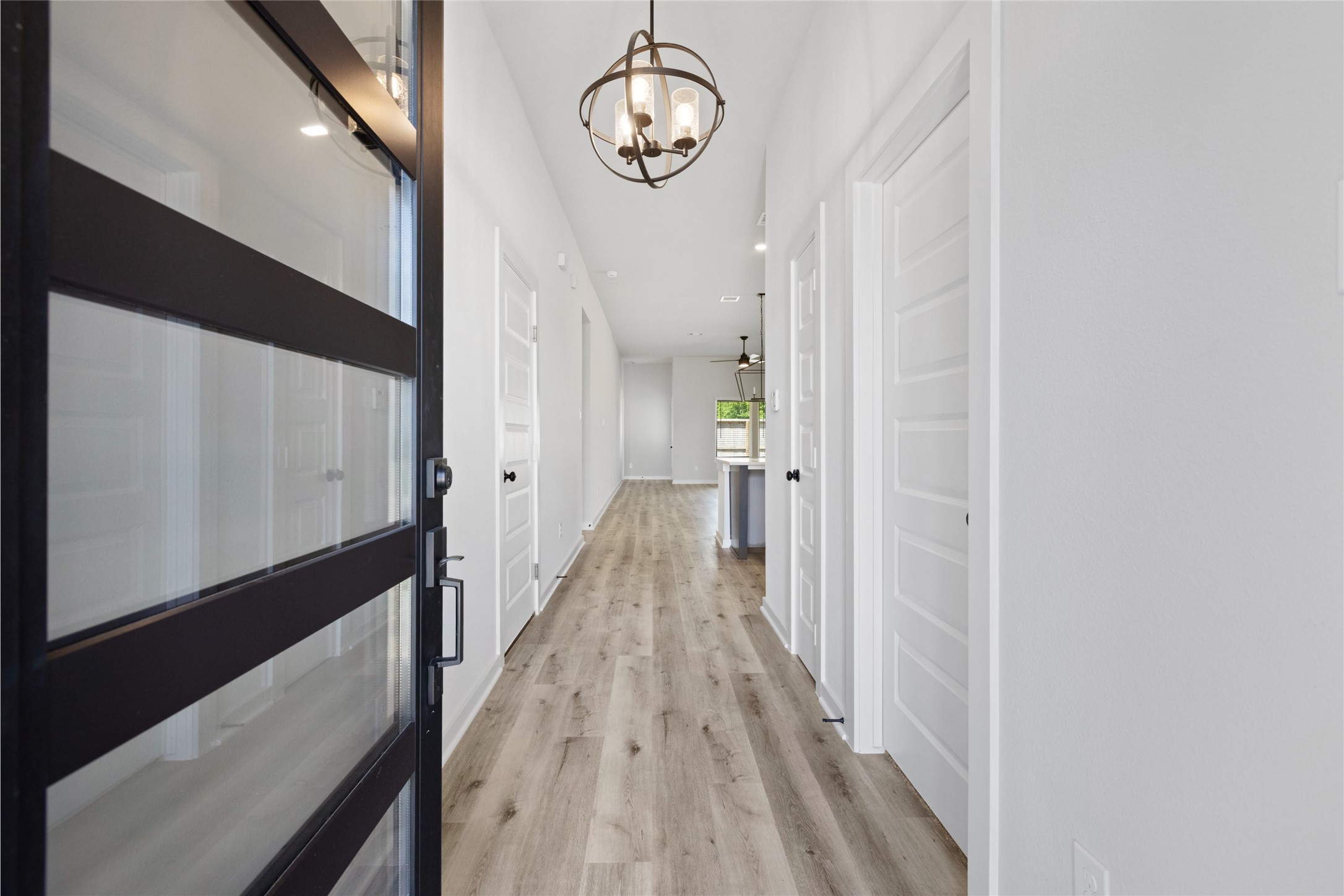 8323 Amber Summit Lane Angleton, TX 77515 - Photo 5 of 24 a view of a hallway with wooden floor
