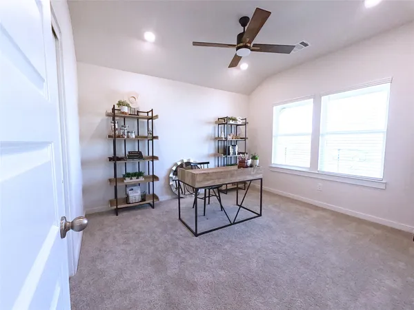 a kitchen with stainless steel appliances kitchen island granite countertop a refrigerator a stove top oven a sink dishwasher and a stove