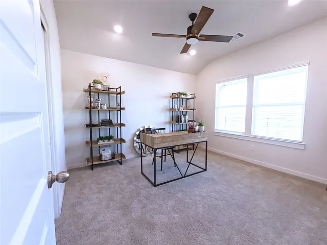 a kitchen with stainless steel appliances kitchen island granite countertop a refrigerator a stove top oven a sink dishwasher and a stove