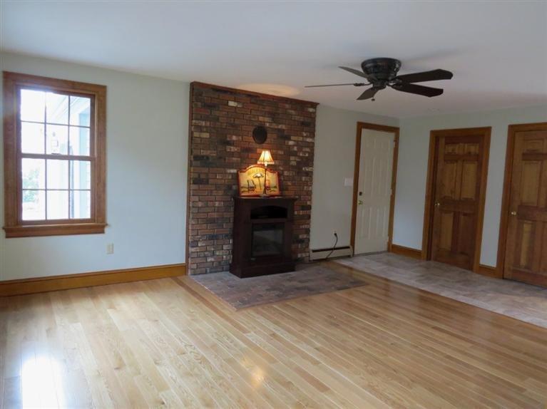 181 Cap'n Lijah's Road Centerville, MA 02632 - Photo 11 of 25 a view of an empty room with wooden floor and a window