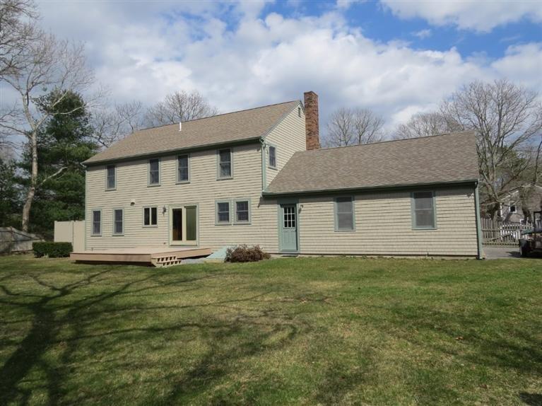 181 Cap'n Lijah's Road Centerville, MA 02632 - Photo 2 of 25 a front view of a house with a garden