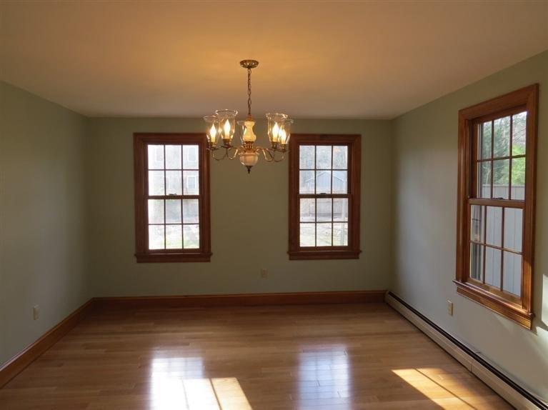 181 Cap'n Lijah's Road Centerville, MA 02632 - Photo 5 of 25 a view of an empty room with wooden floor and a window