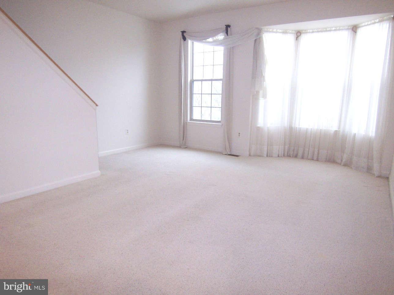 29 Bank Spring Court Owings Mills, MD 21117 - Photo 3 of 16 an empty room with windows