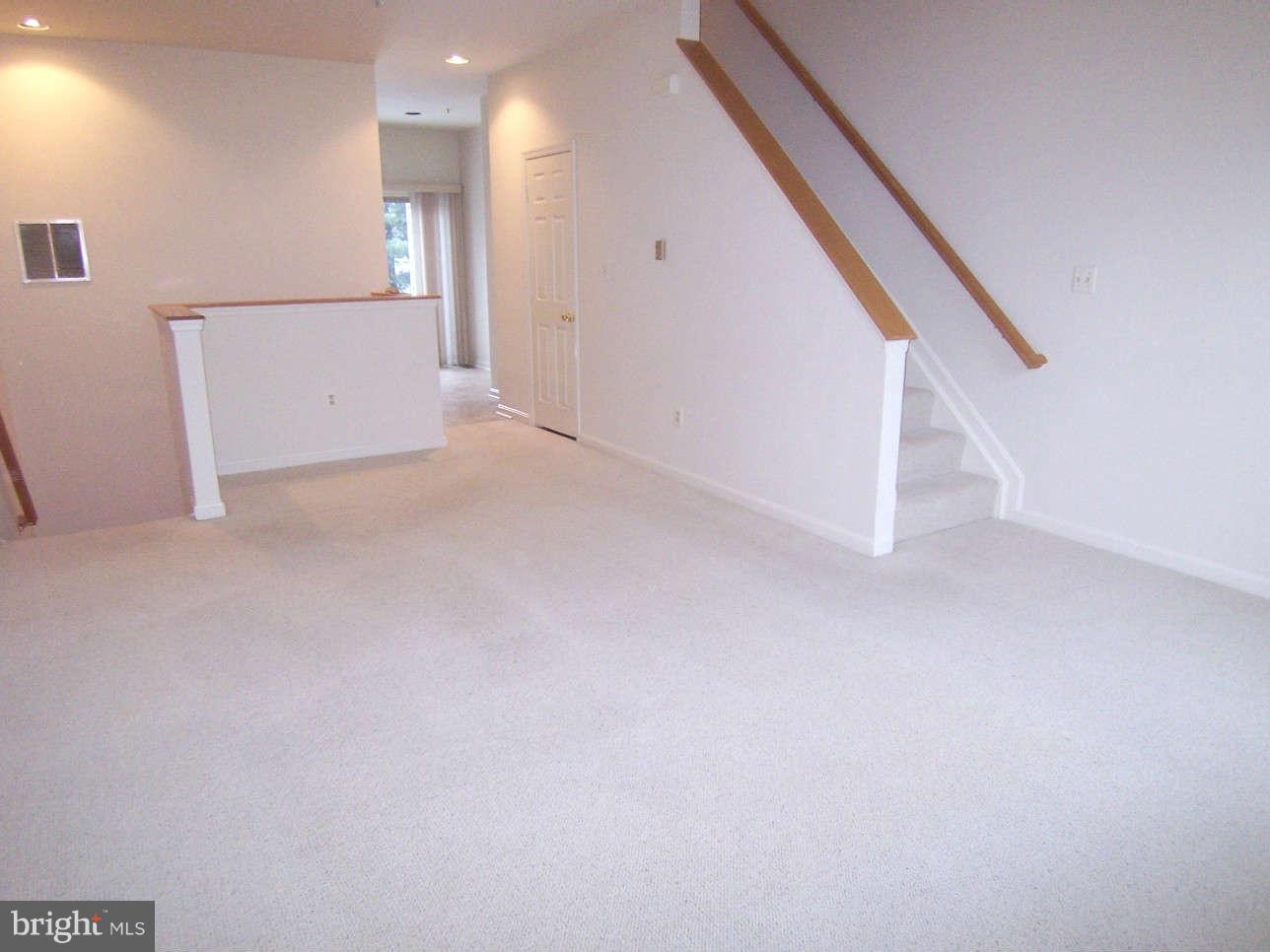 29 Bank Spring Court Owings Mills, MD 21117 - Photo 4 of 16 a view of an empty room with stairs