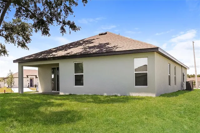 a view of a backyard with potted plants